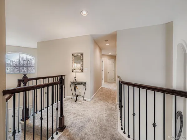 a view of a hallway with a to room and stairs
