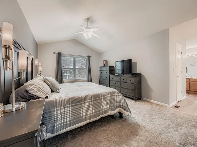 a bedroom with bed and tv