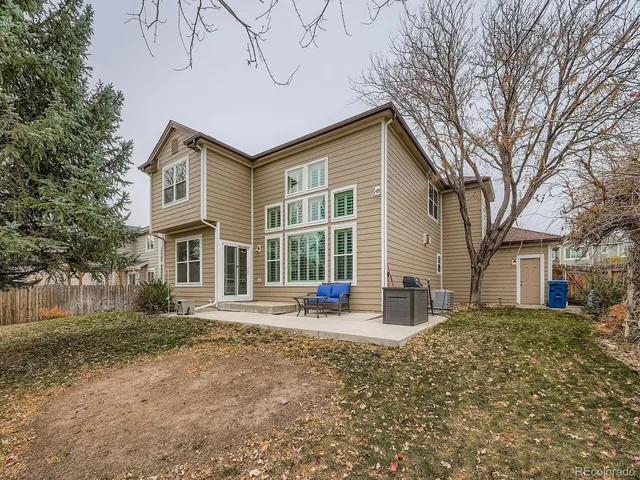 a backyard of a house with seating space