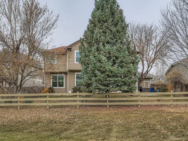a house with trees in the background