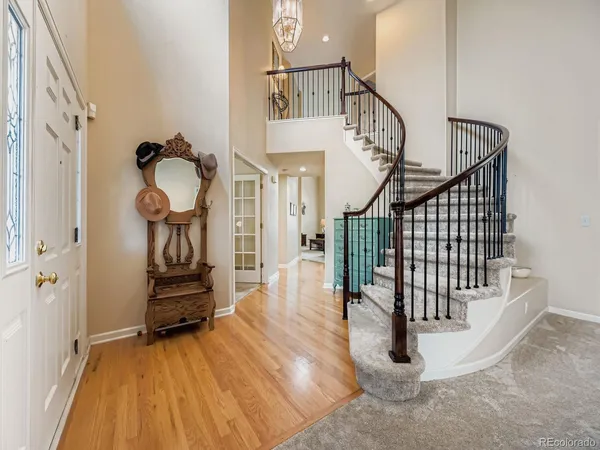 a view of entryway with wooden floor
