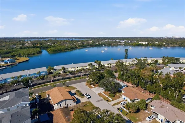 an aerial view of a house with a lake view