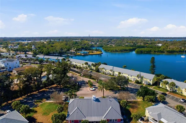 an aerial view of lake and houses with outdoor space
