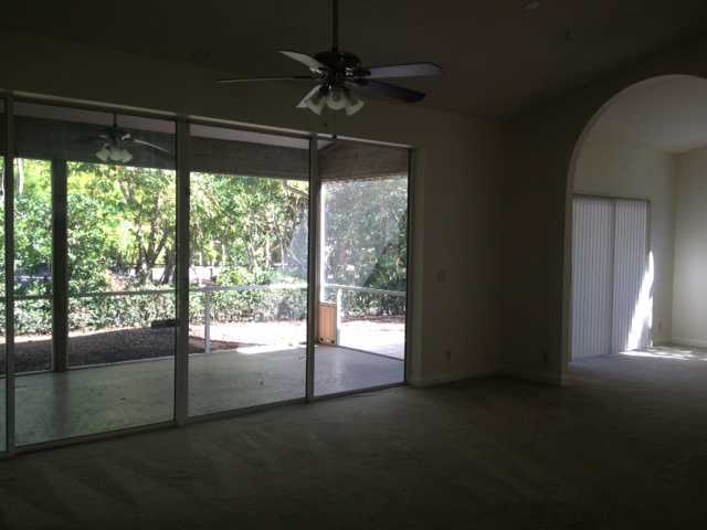 114 Colony Way East Jupiter, FL 33458 - Photo 5 of 7 a view of empty room with floor to ceiling window