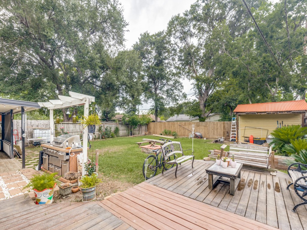 124 Bluebird Lane Pasadena, TX 77502 - Photo 2 of 25 a view of a table and chairs on the roof deck