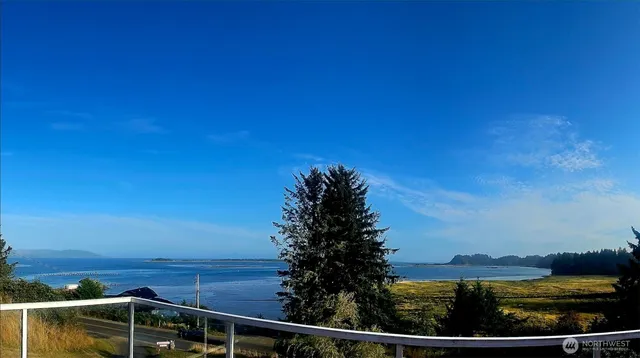 a view of a lake with sunset