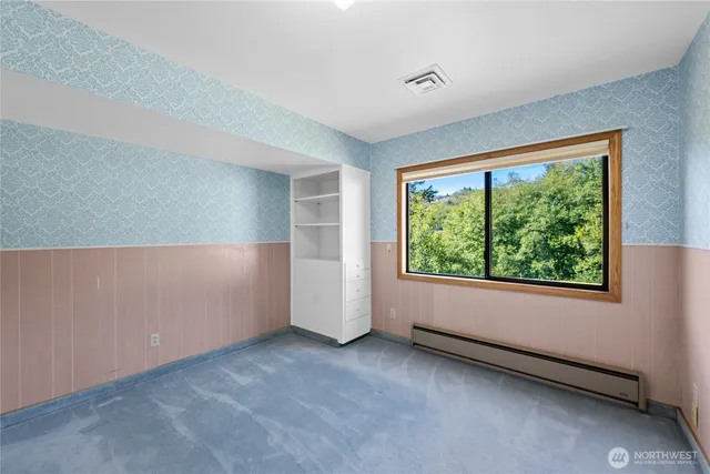 a view of an empty room with a window