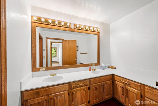 a bathroom with a sink and a mirror