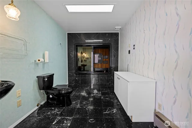 a hallway with a white stove top oven and furniture