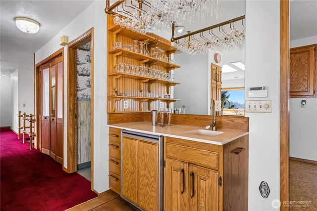 a view of a kitchen with a sink and cabinets