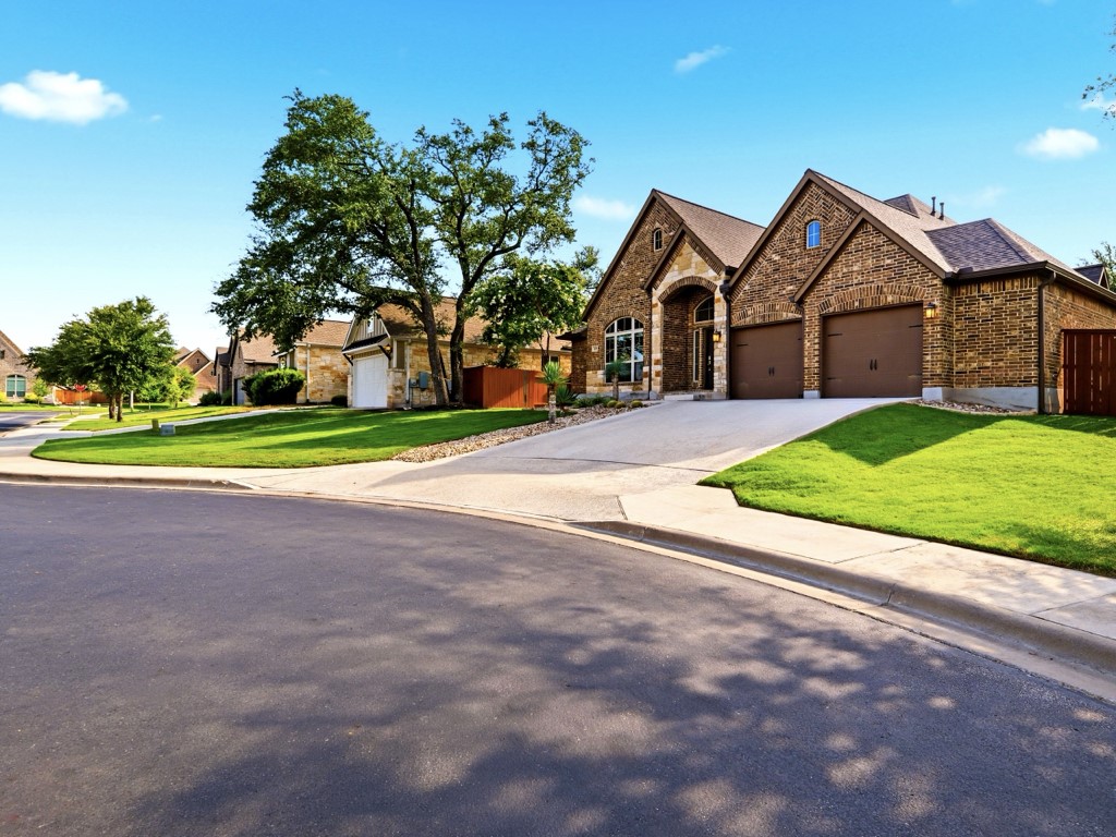 A classic brick exterior with a prominent arched entry welcomes you home.