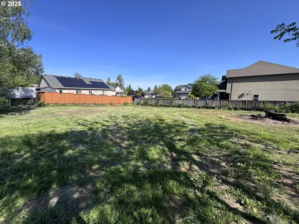 a view of a big yard with a house