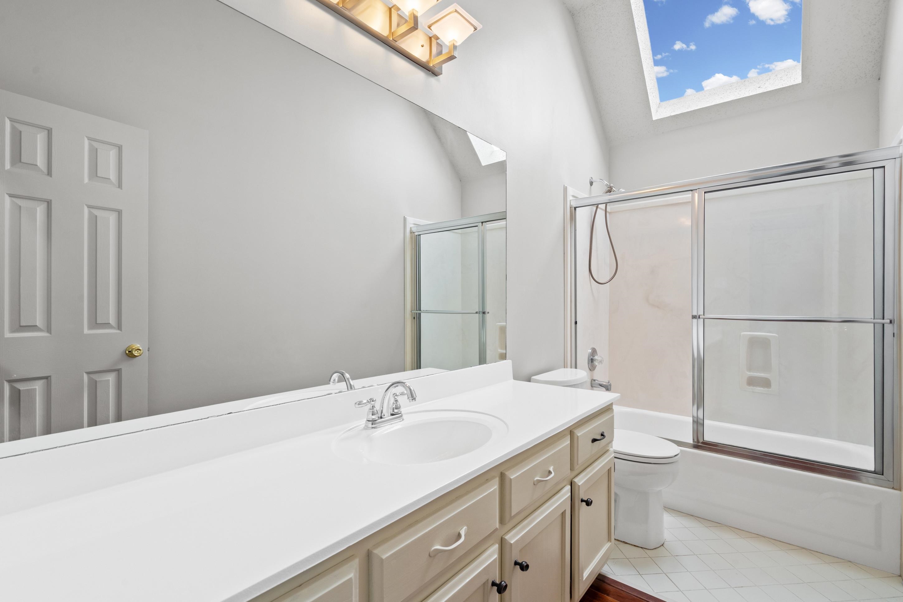 1301 Wolf Lair Drive Collierville, TN 38017 - Photo 20 of 32 Full bath featuring vanity, enclosed tub / shower combo, and light tile patterned floors