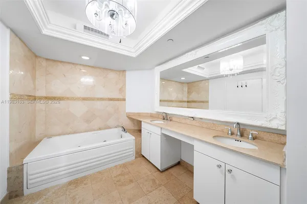 a bathroom with a sink a toilet a mirror and bathtub