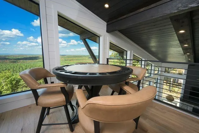 a outdoor dining space with furniture and outdoor view