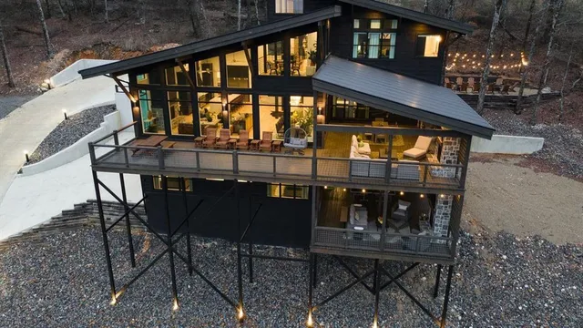 a view of a chairs and table in the balcony
