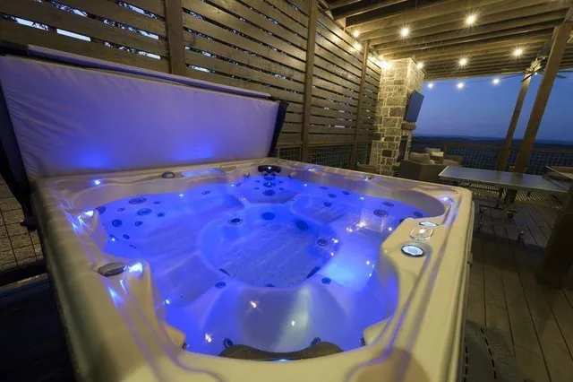 a view of a patio with a table chairs and a fire pit