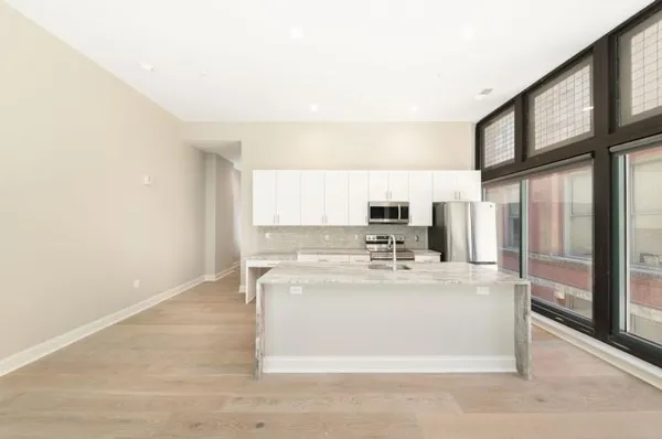 a view of a kitchen with a sink