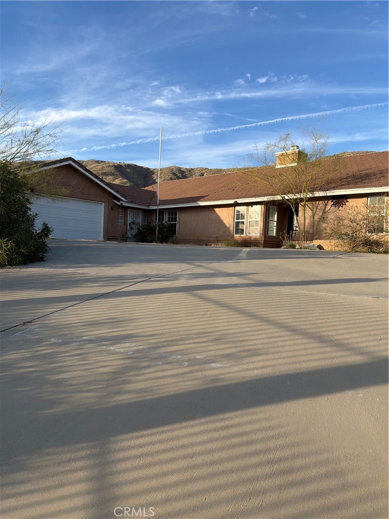 48628 Adeline Way Morongo Valley, CA 92256 - Photo 1 of 26 an aerial view of residential houses with car parked