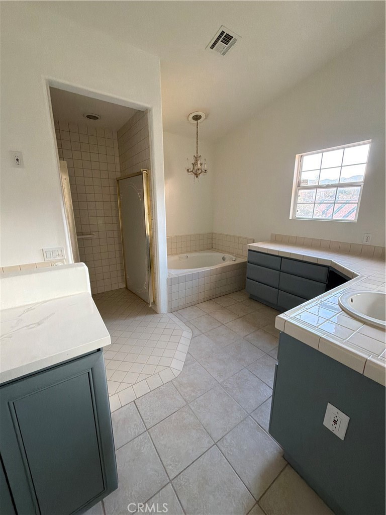 48628 Adeline Way Morongo Valley, CA 92256 - Photo 16 of 26 a kitchen with a sink a stove and a refrigerator