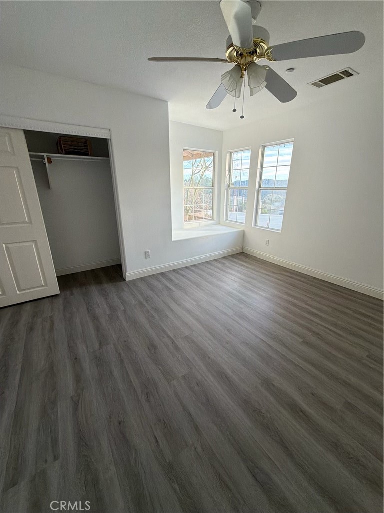 48628 Adeline Way Morongo Valley, CA 92256 - Photo 21 of 26 a view of an empty room with window and wooden floor