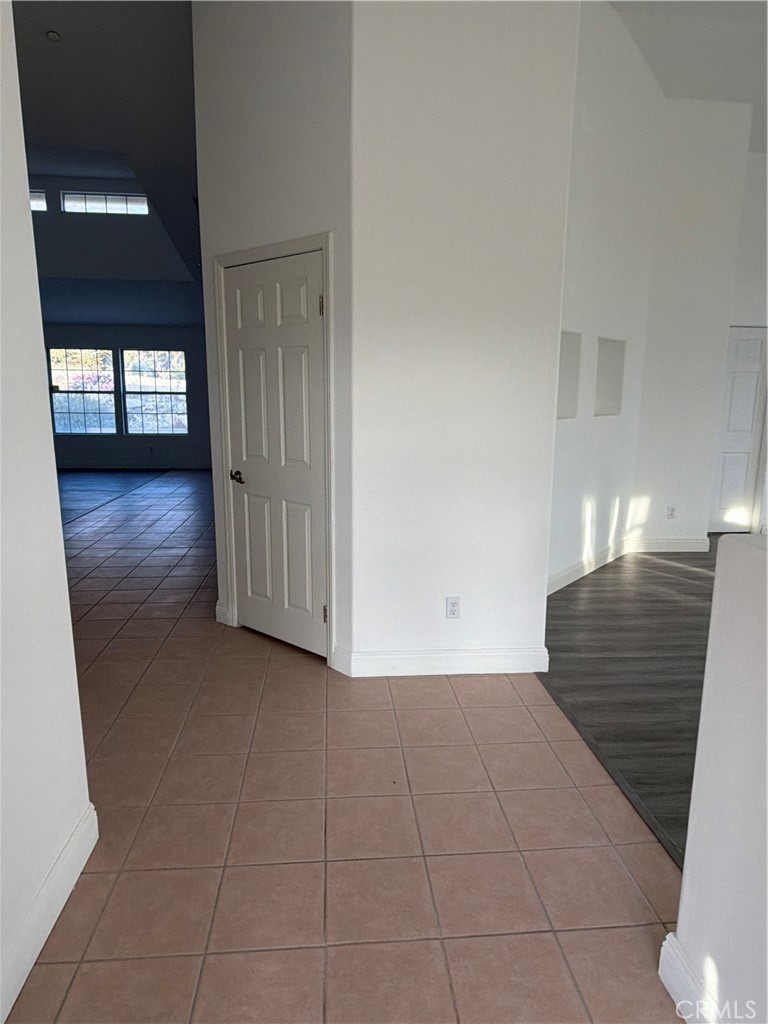 48628 Adeline Way Morongo Valley, CA 92256 - Photo 3 of 26 a view of an empty room with wooden floor and a window