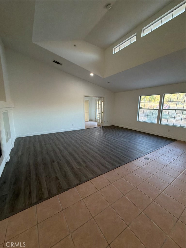48628 Adeline Way Morongo Valley, CA 92256 - Photo 9 of 26 a view of empty room with wooden floor and fan