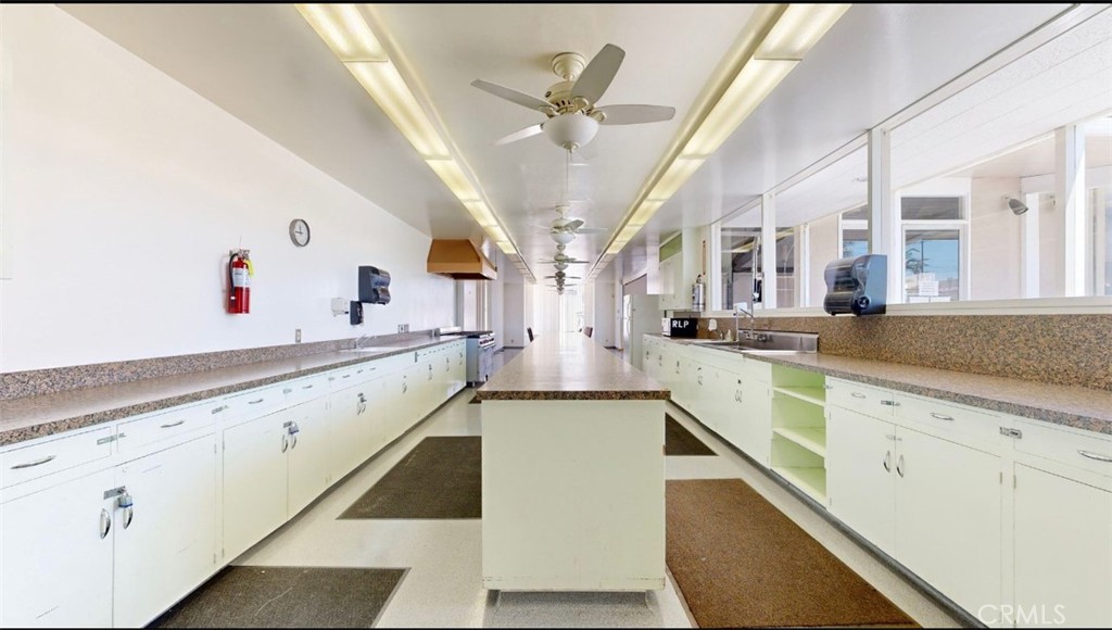 55 Walnut Via Anaheim, CA 92801 - Photo 21 of 25 a view of living room with stainless steel appliances granite countertop furniture and a kitchen view