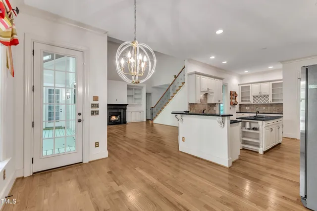 a view of kitchen with sink microwave refrigerator and stove