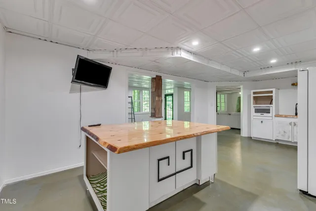 a room with furniture and flat screen tv