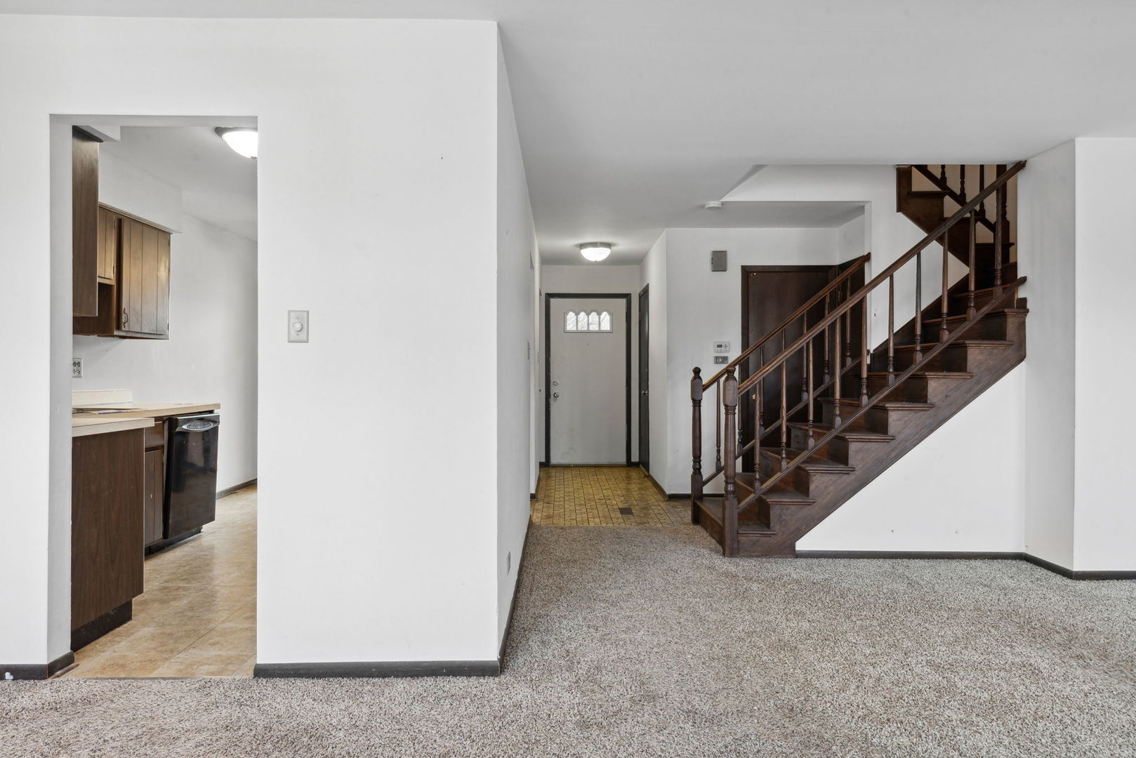 889 Heatherbrook Court Wheaton, IL 60189 - Photo 6 of 24 a view of a hallway with staircase