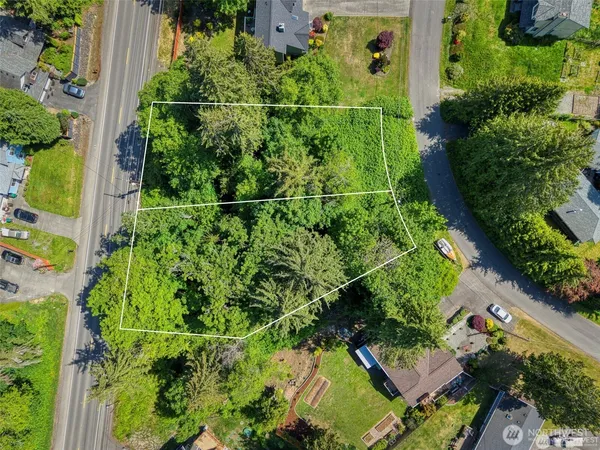 an aerial view of a house with a yard