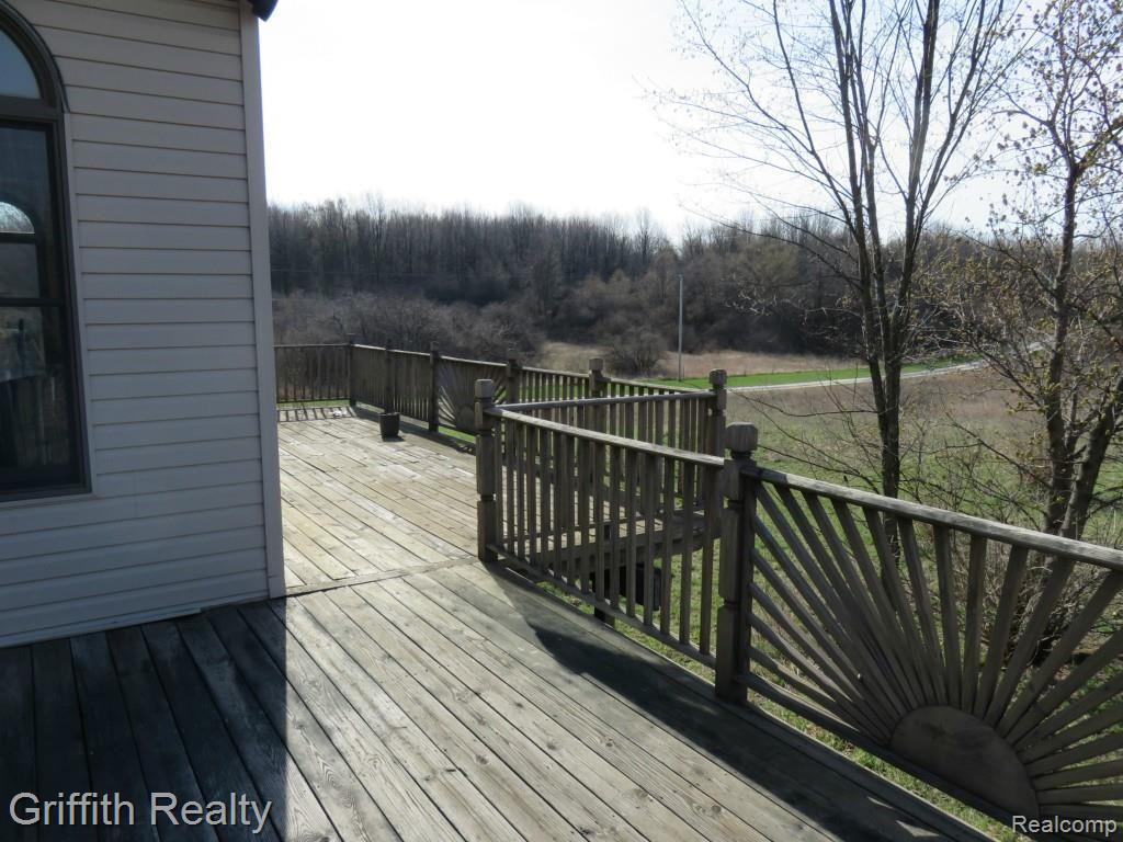 20563 Wasson Road Pinckney, MI 48169 - Photo 8 of 44 Expansive decking to entertain upon or to contemplate over while alone...