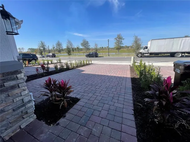 a view of a terrace with chairs and potted plants