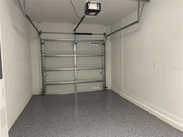 a view of a house with backyard porch and sitting area