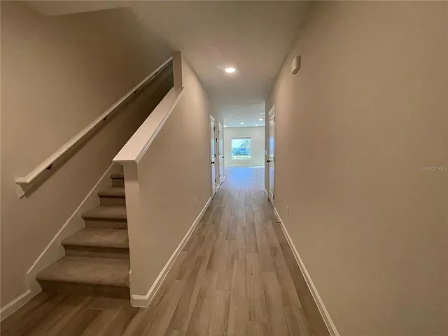 a view of entryway with wooden floor