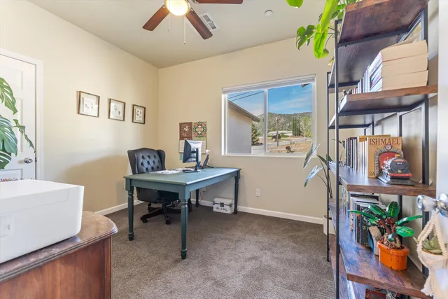 a view of a workspace with furniture