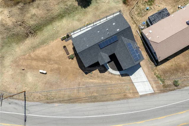wooden floor with view of bathroom