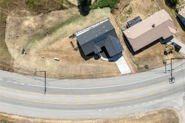 wooden floor with view of living room