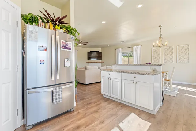 a kitchen with stainless steel appliances a refrigerator and a sink