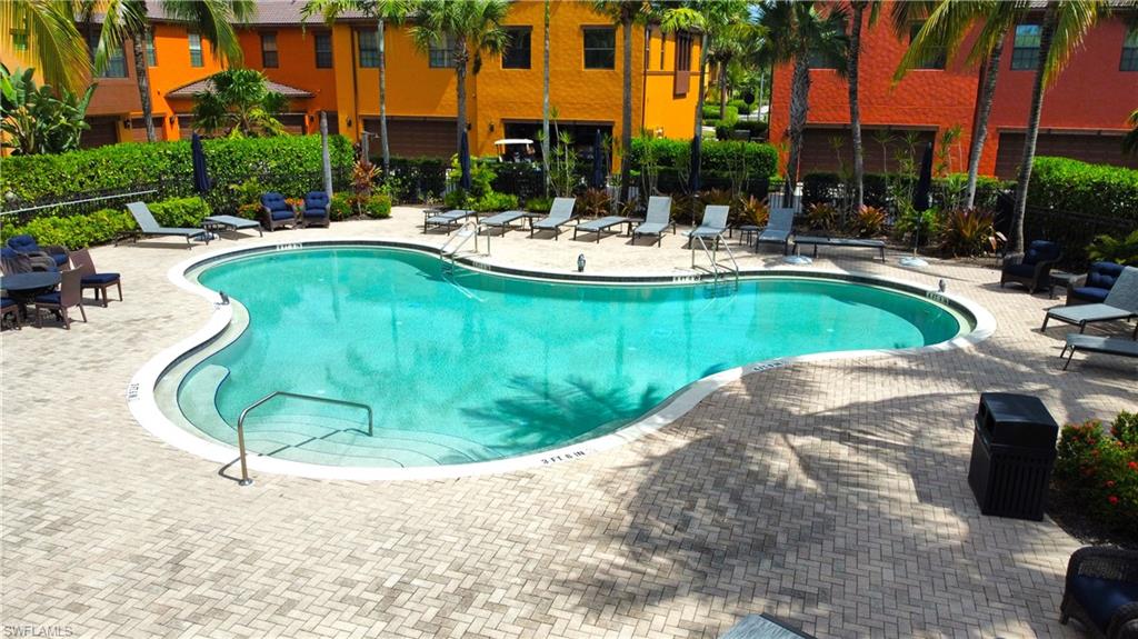 9067 Capistrano Street North, Unit 4503 Naples, FL 34113 - Photo 1 of 41 a view of a swimming pool with a patio