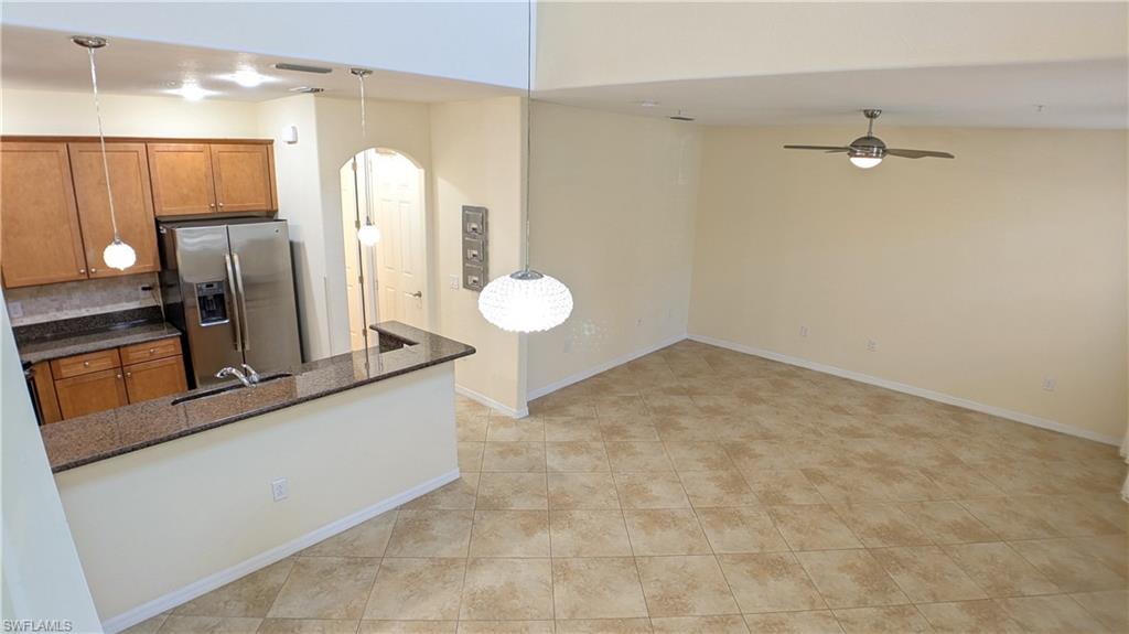 9067 Capistrano Street North, Unit 4503 Naples, FL 34113 - Photo 11 of 41 a view of a kitchen with a sink