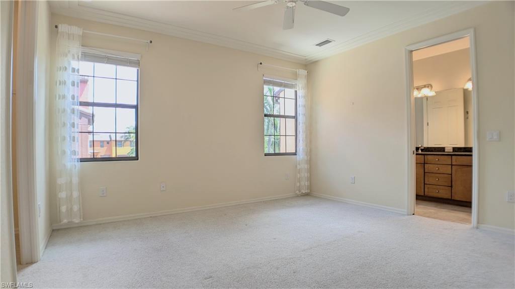 9067 Capistrano Street North, Unit 4503 Naples, FL 34113 - Photo 15 of 41 an empty room with windows and closet