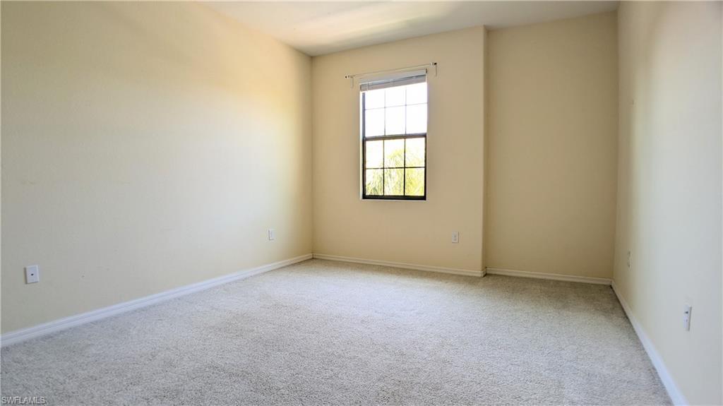 9067 Capistrano Street North, Unit 4503 Naples, FL 34113 - Photo 19 of 41 an empty room with a window
