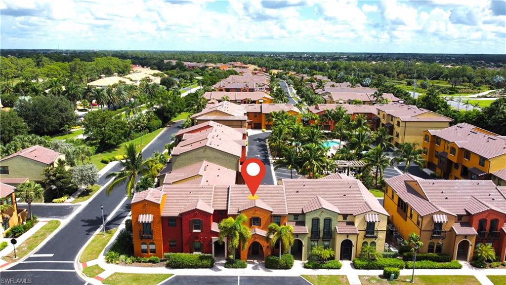 9067 Capistrano Street North, Unit 4503 Naples, FL 34113 - Photo 2 of 41 an aerial view of residential houses with outdoor space and swimming pool