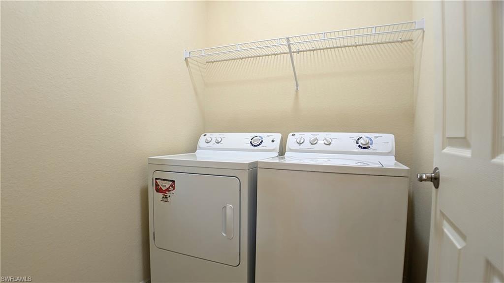 9067 Capistrano Street North, Unit 4503 Naples, FL 34113 - Photo 22 of 41 a utility room with dryer and washer