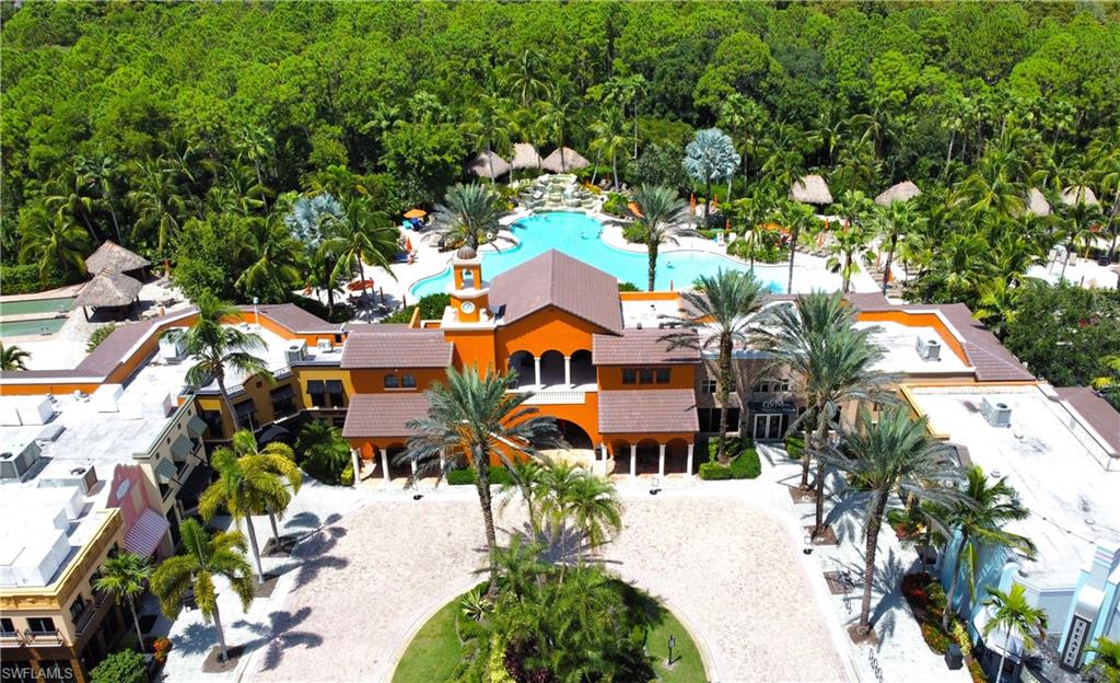 9067 Capistrano Street North, Unit 4503 Naples, FL 34113 - Photo 29 of 41 an aerial view of multiple houses with yard