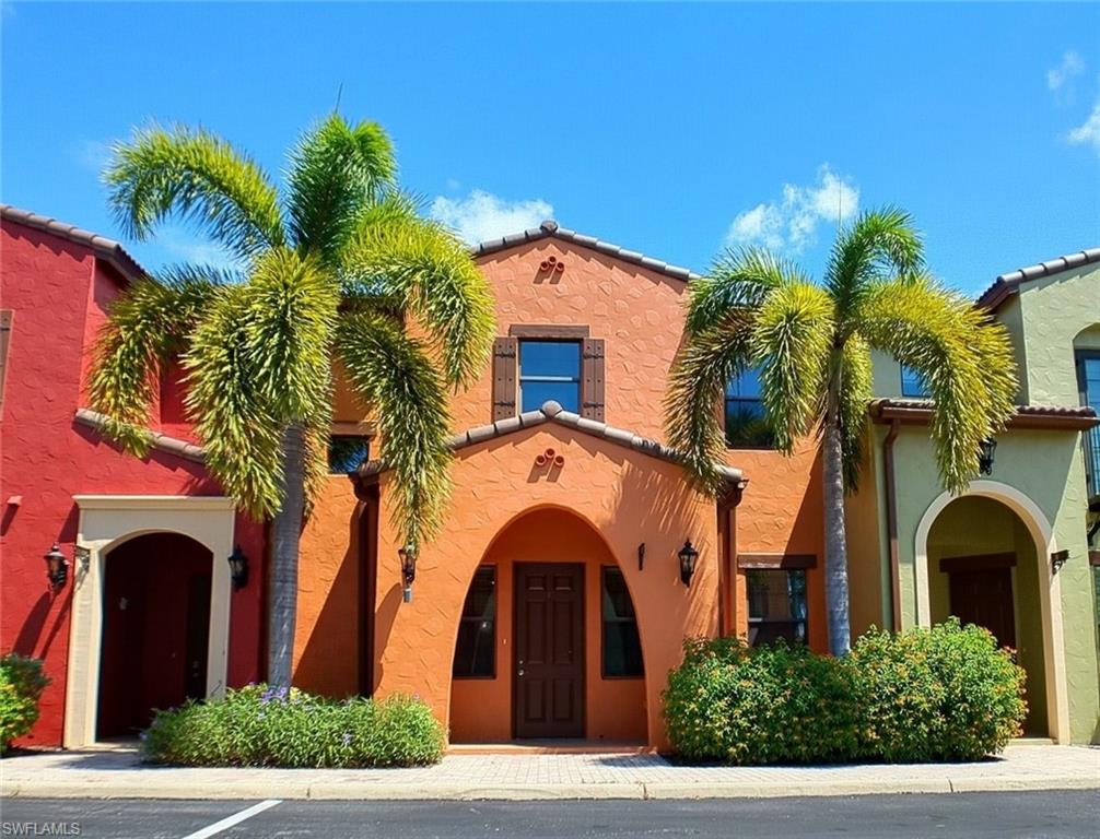 9067 Capistrano Street North, Unit 4503 Naples, FL 34113 - Photo 3 of 41 a front view of a house with a garden
