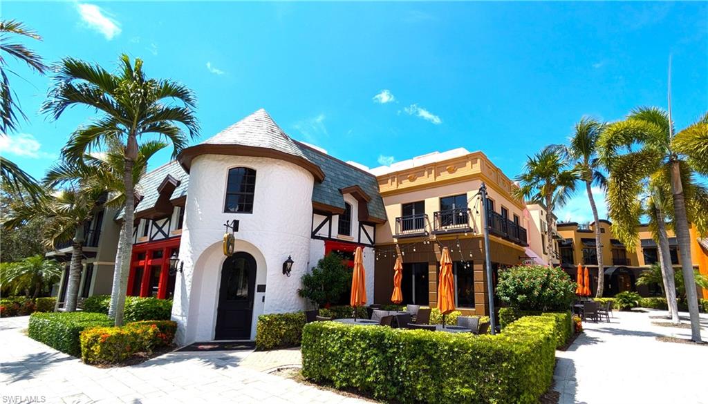 9067 Capistrano Street North, Unit 4503 Naples, FL 34113 - Photo 34 of 41 a front view of a multi story residential apartment buildings