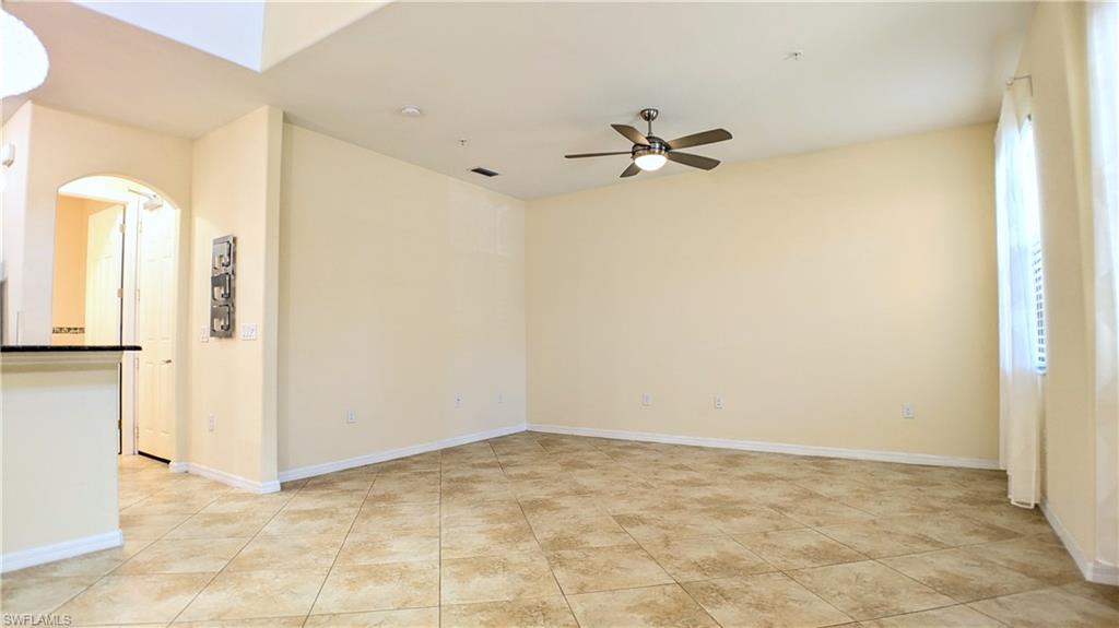 9067 Capistrano Street North, Unit 4503 Naples, FL 34113 - Photo 7 of 41 a view of a room with a hallway and a chandelier
